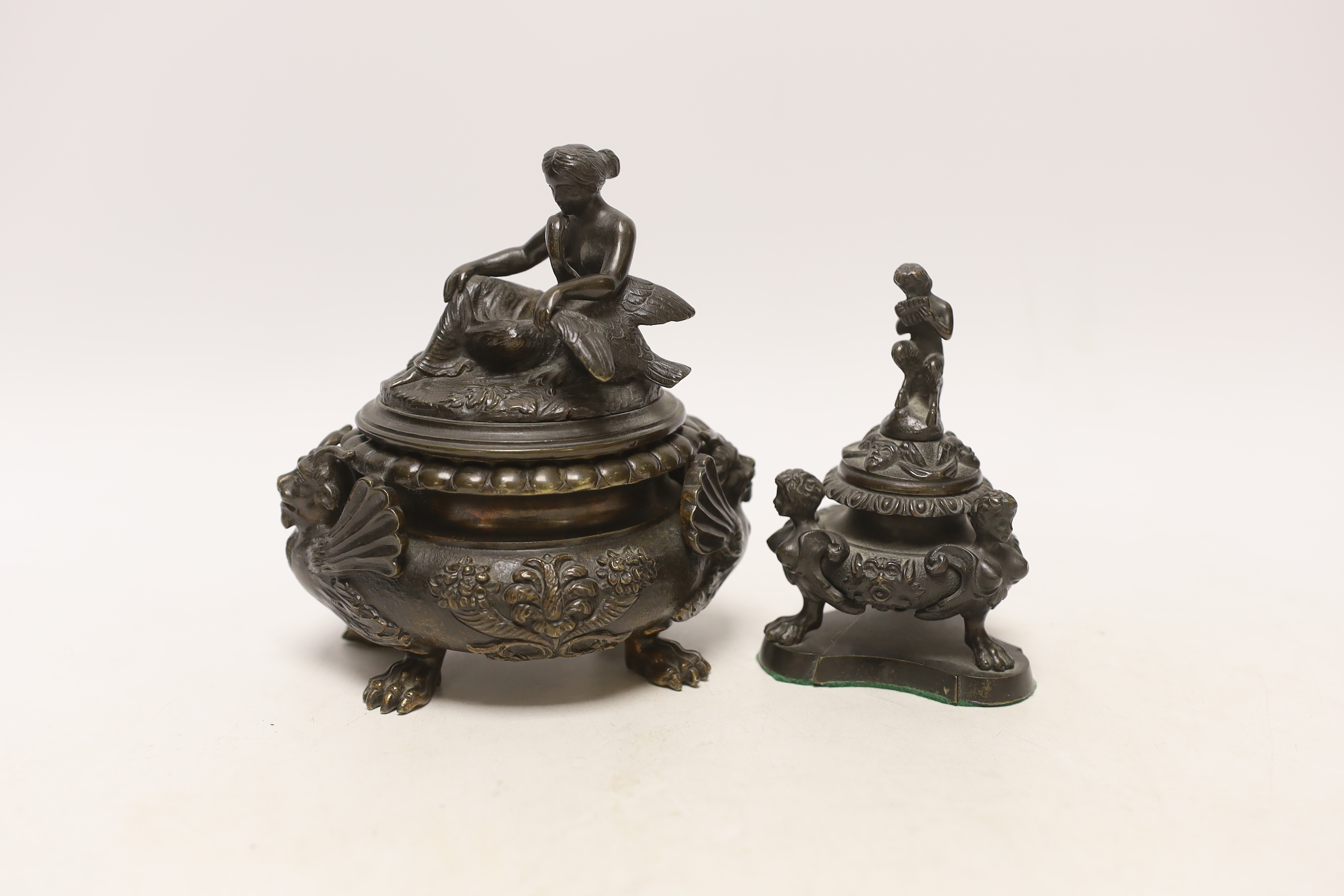 A classical revival bronze Leda and the swan vessel and a Pan playing the pipes inkwell